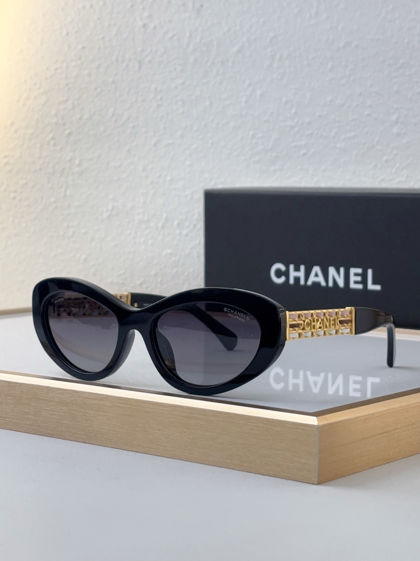 Chanel Black Acetate Cat - Eye Sunglasses with Gold Openwork "CHANEL" - Inlaid Temples (Model: CH5641)