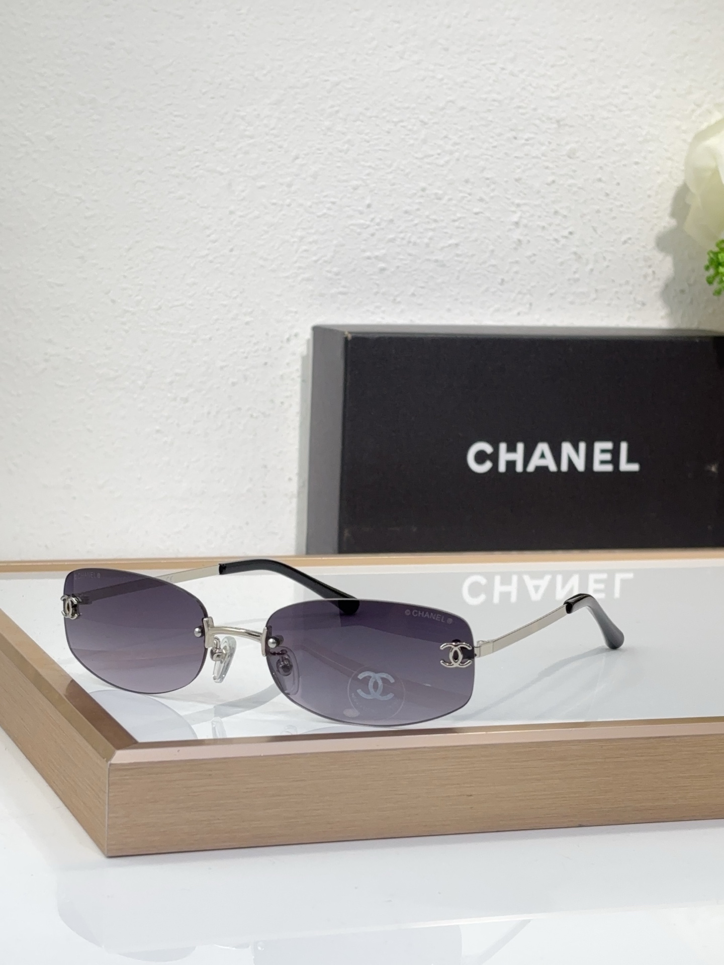 Chanel Silver - Tone Metal Oval Rimless Sunglasses with CC Motif (Model: CH4210)