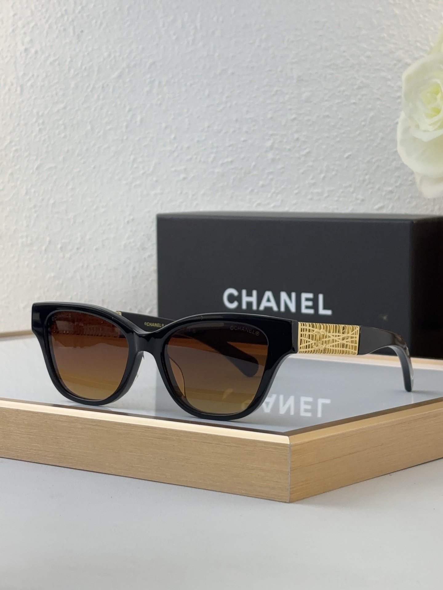 Chanel Black Acetate Cat - Eye Sunglasses with Gold - Woven Temples & Brown - Gradient Lenses (Model: CH5611)