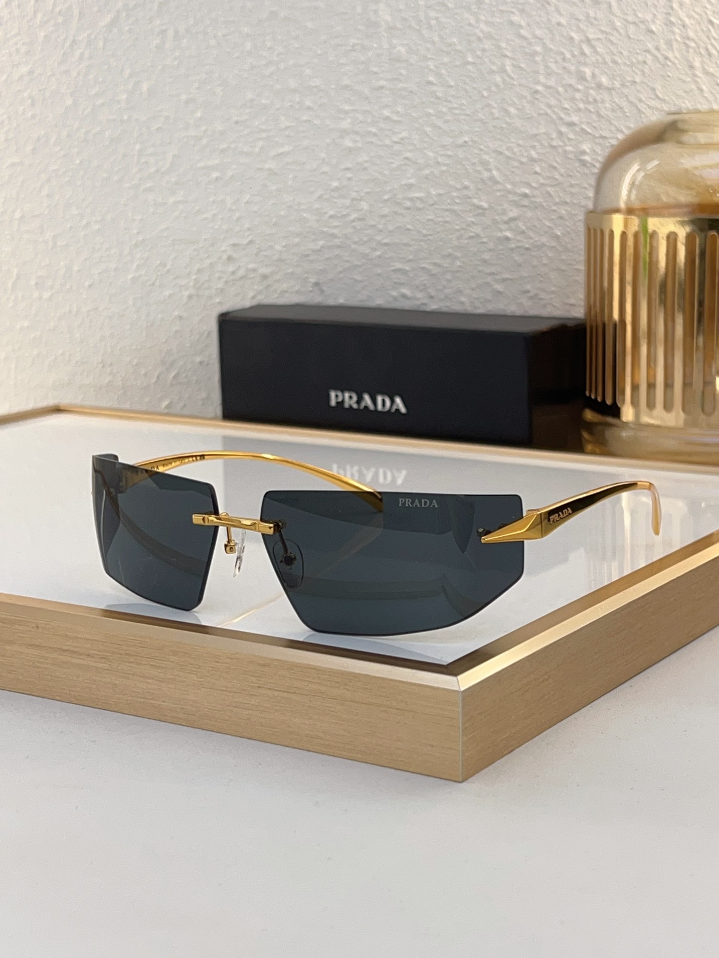Prada Silver - Tone Metal Rimless Geometric Sunglasses (Model: PR14247S)