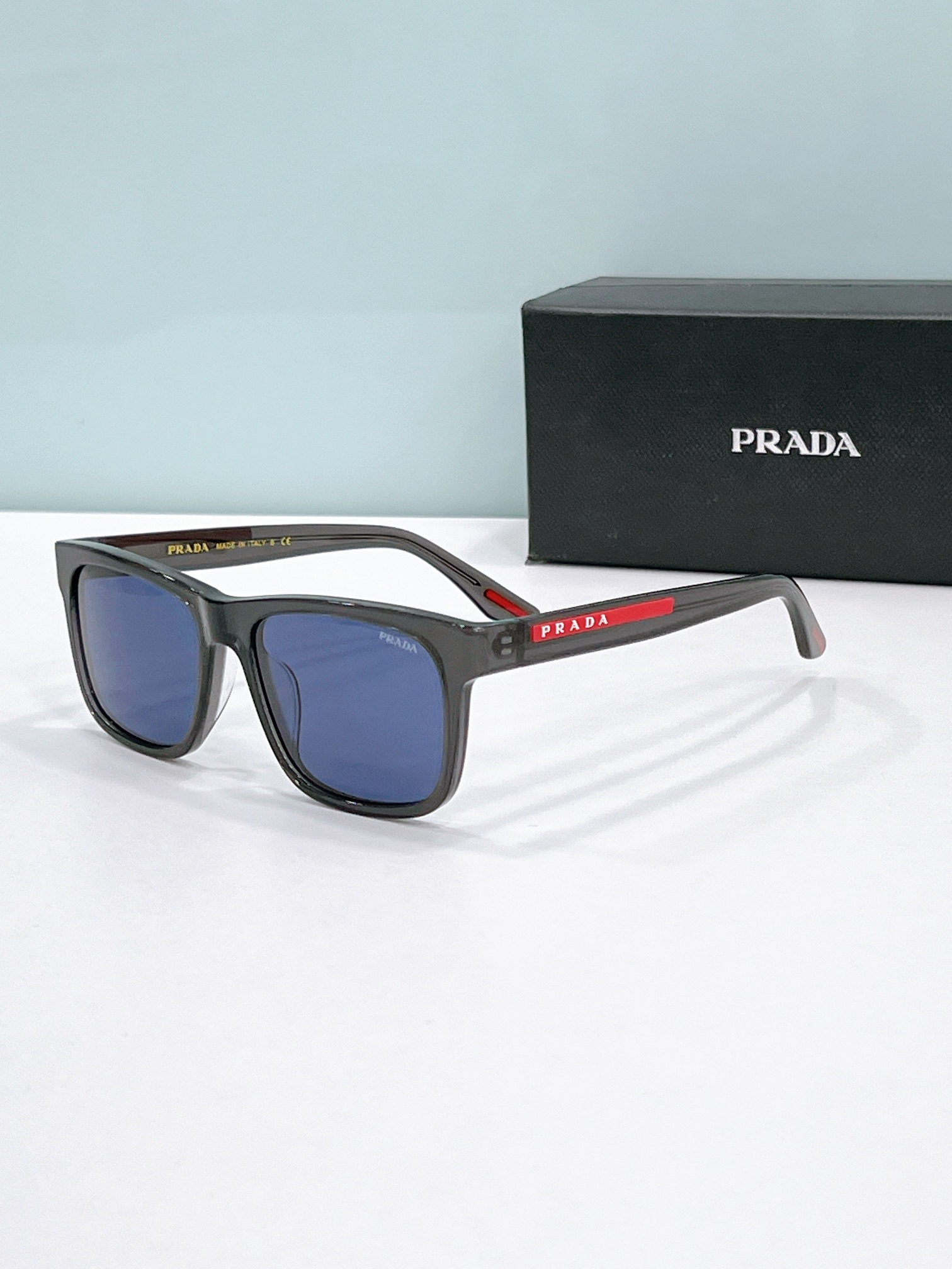Prada Clear Acetate Square Sunglasses with Red - Black Accents (Model: PR13458S)