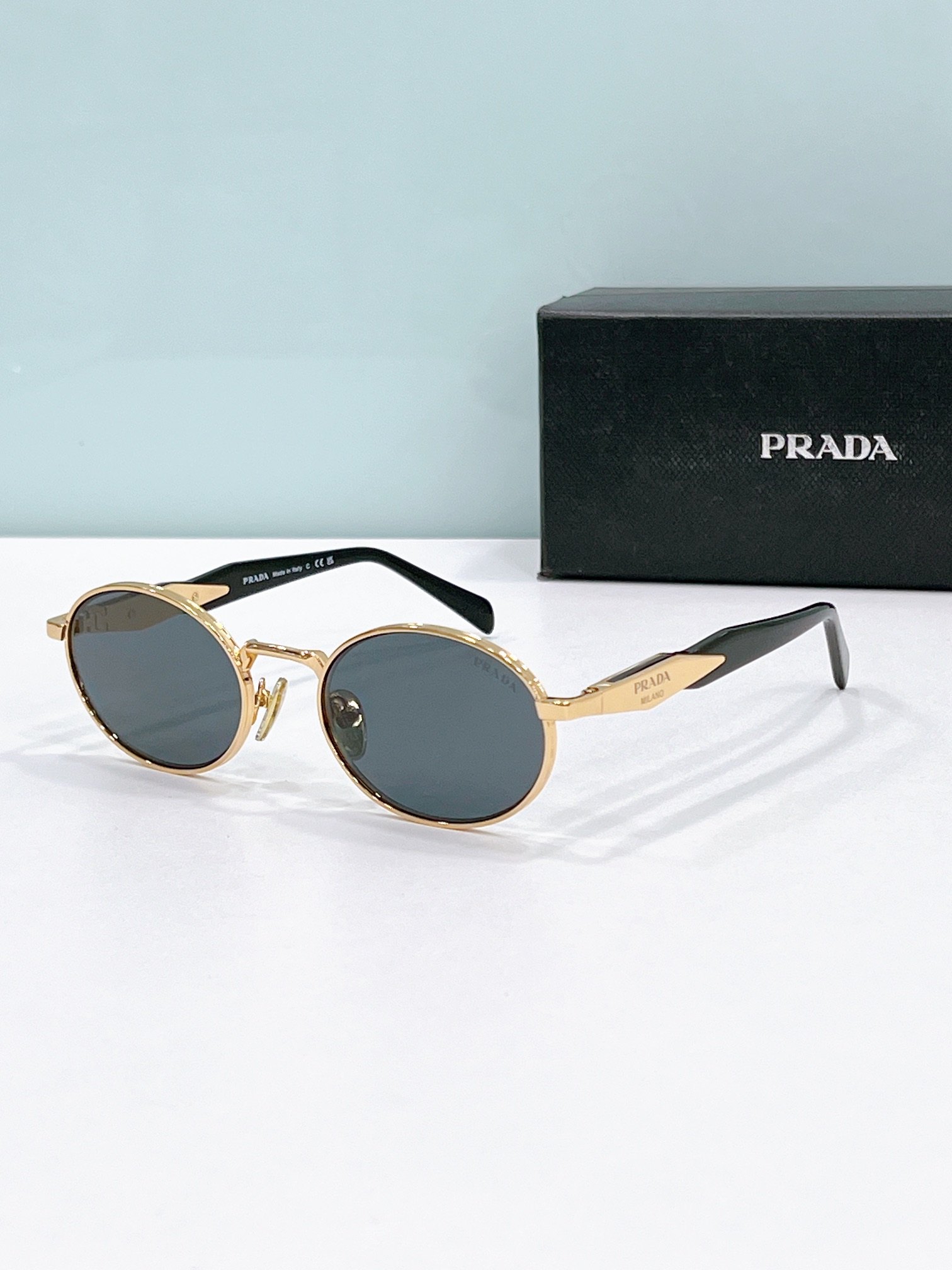 Prada Gold - Tone Metal Oval Sunglasses with Black Acetate Temples (Model: PR4347S)