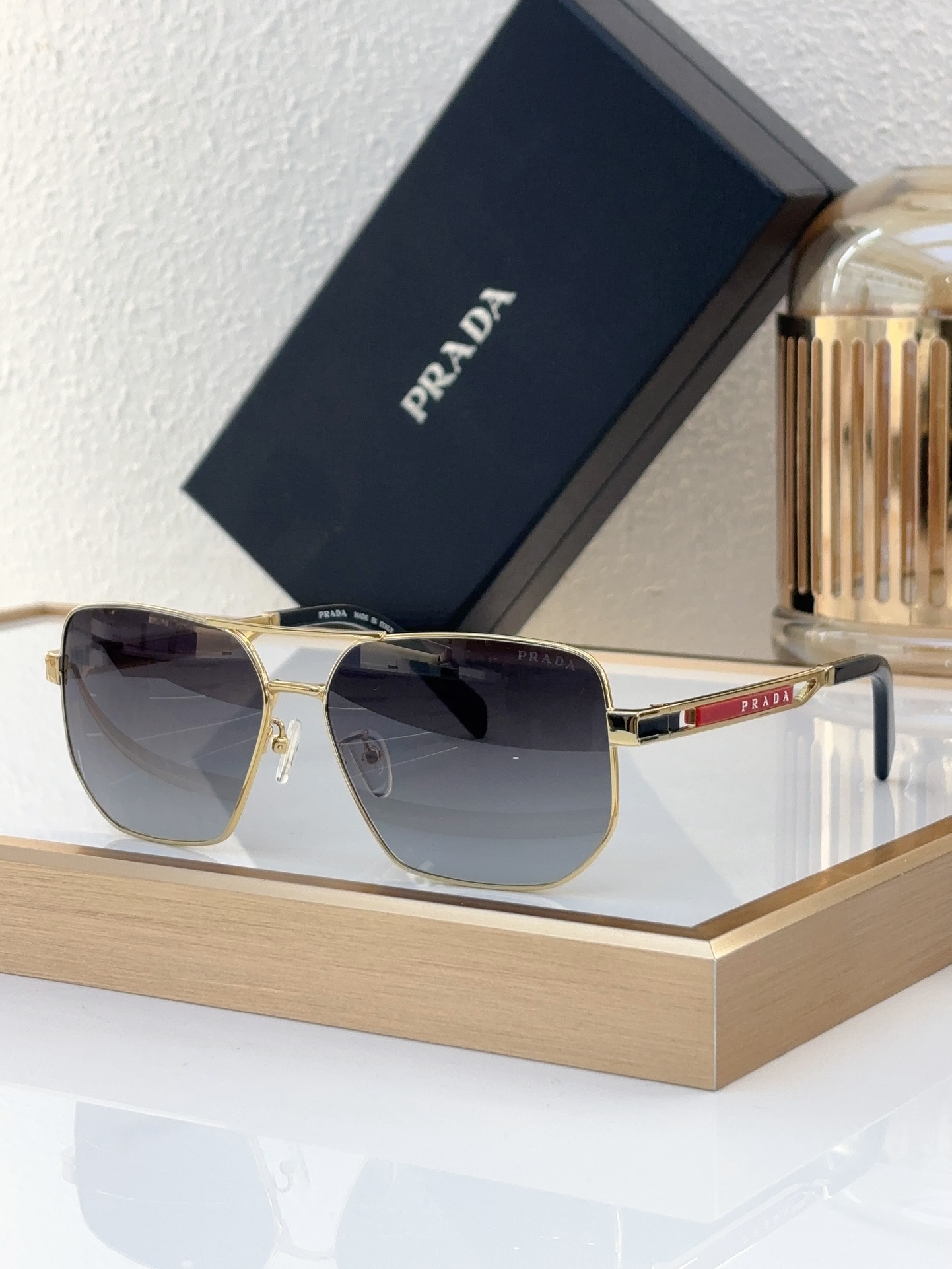 Prada Gold - Tone Metal Aviator Sunglasses with Red Accents (Model: PR3670S)