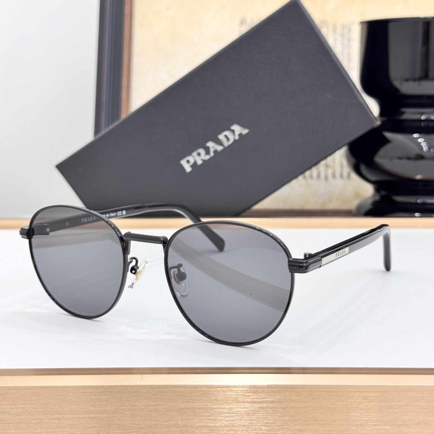 Prada Black Metal Round Sunglasses (Model: PR5566S)