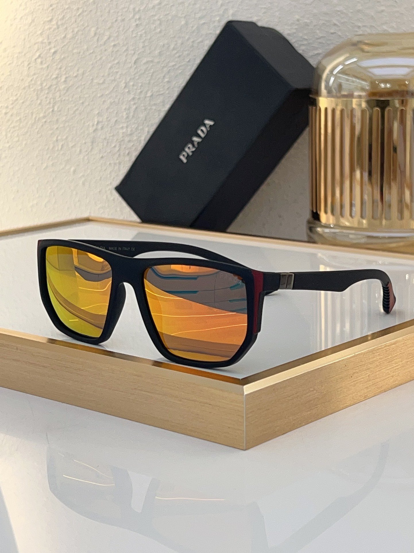 Prada Matte Black Square Sunglasses with Red Accents & Orange Mirrored Lenses (Model: PR5678S)