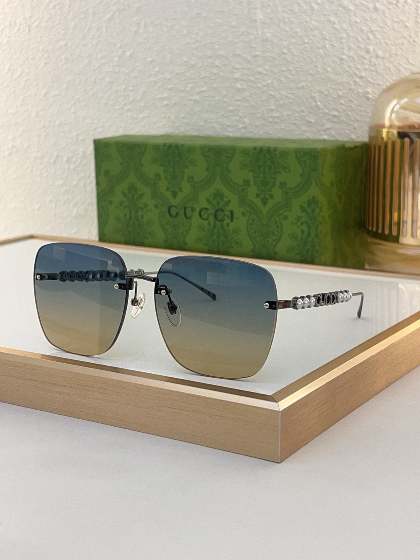 Gucci Gunmetal - Tone Metal Square Rimless Sunglasses with Pearl & Double G Accents (Model: GG1346S)