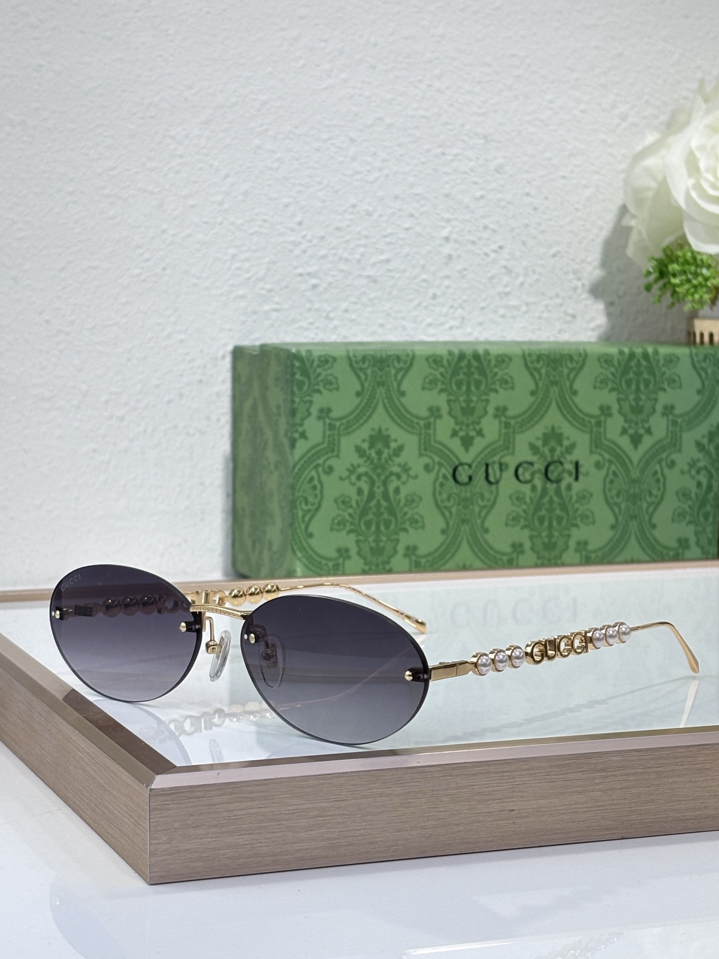 Gucci Gold - Tone Metal Oval Rimless Sunglasses with Pearl & Double G Accents (Model: GG1343S)
