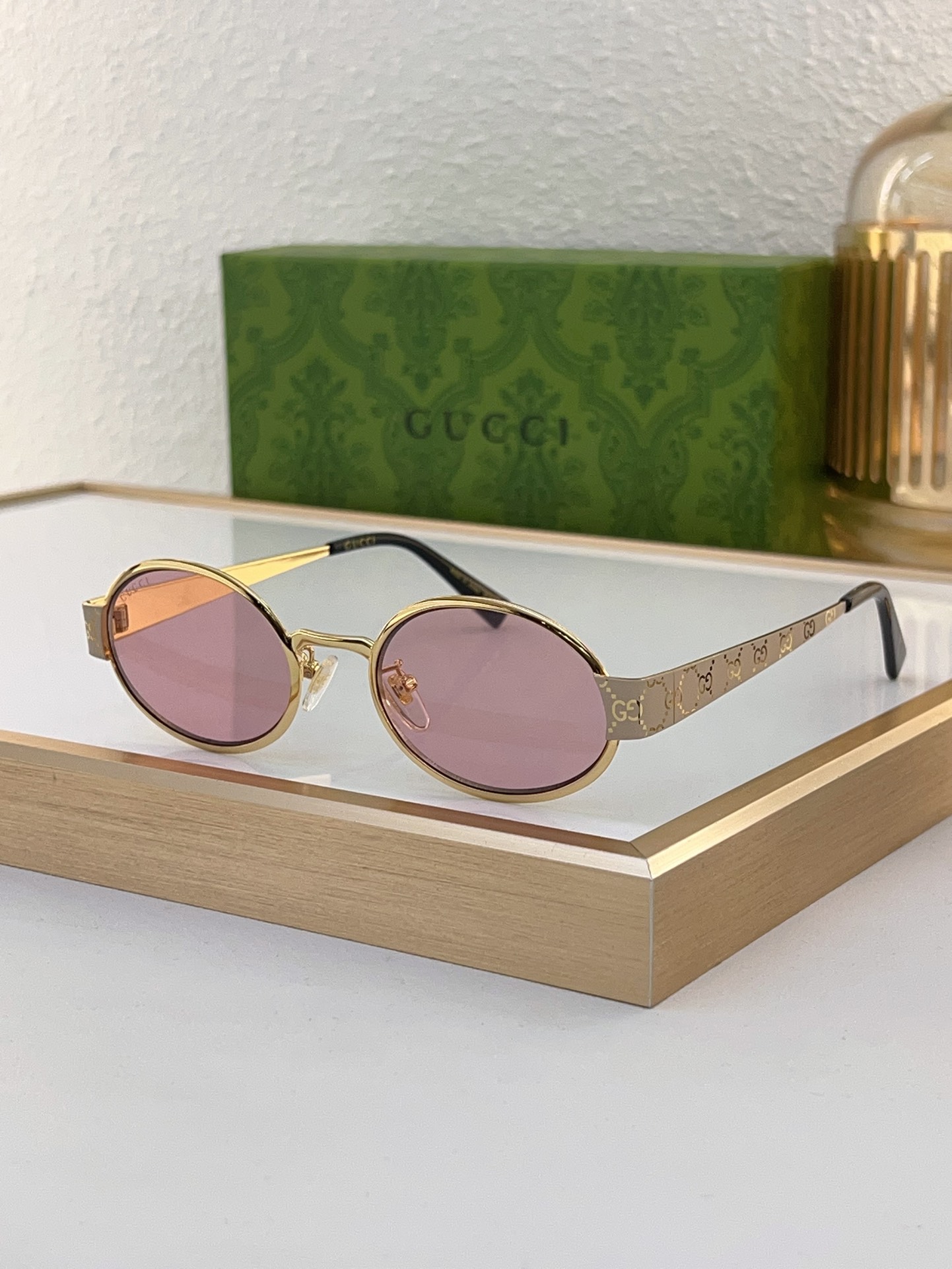 Gucci Gold - Tone Oval Sunglasses with Pink Lenses (Model: GG1304S)