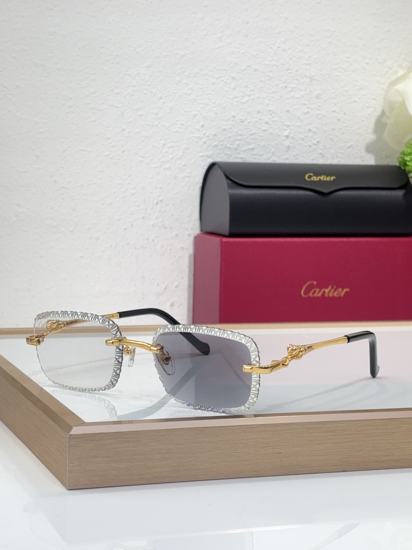 Cartier CT0695S Geometric-Engraved Panther Temple Rimless Sunglasses