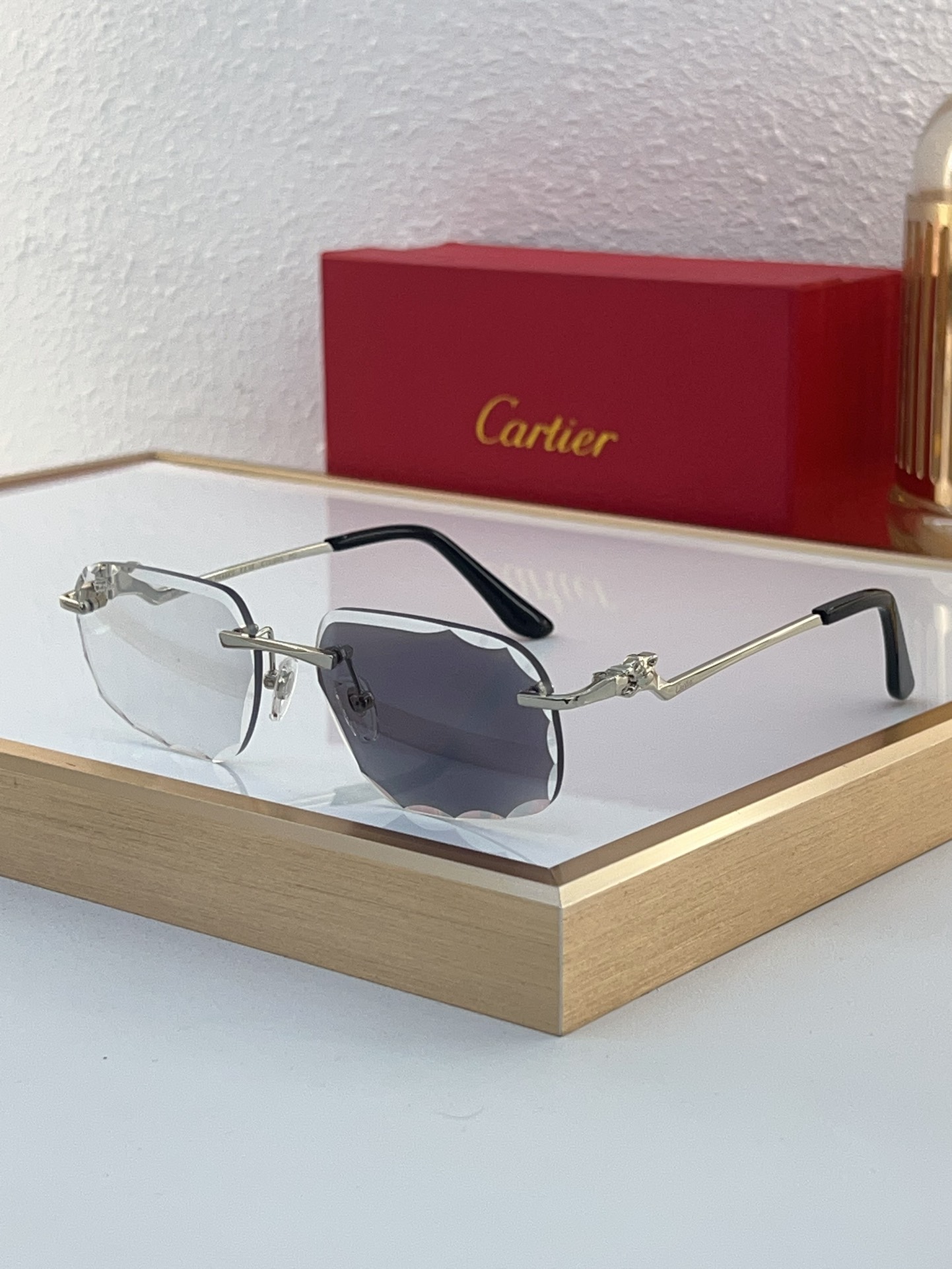 Cartier CT0120O Diamond‑Cut Temple Rimless Sunglasses