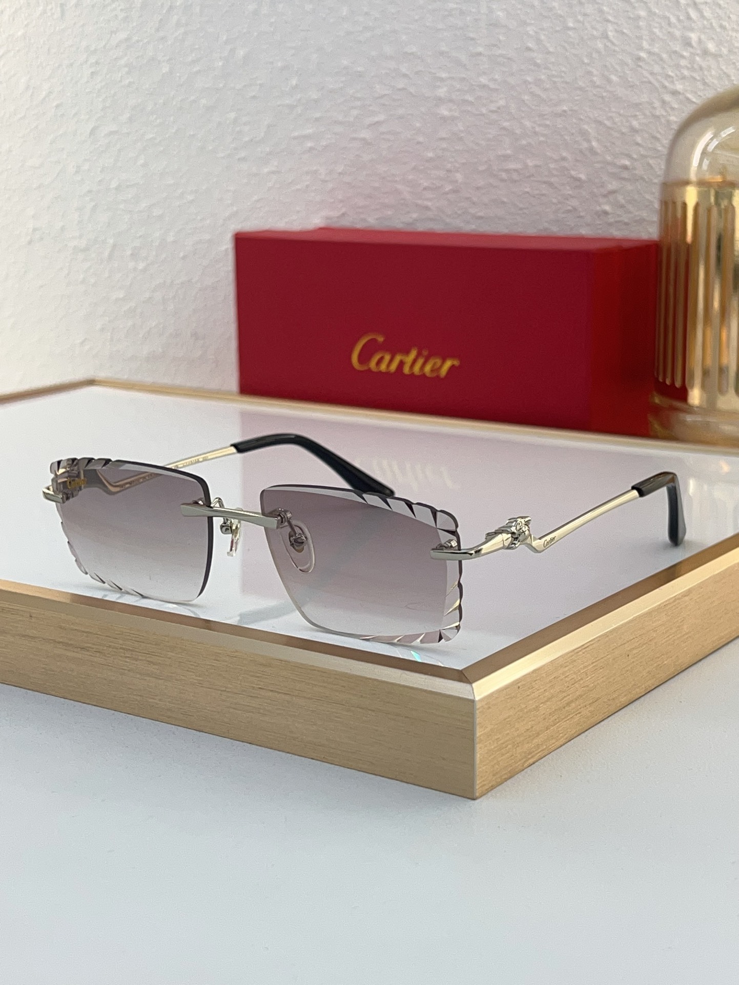 Cartier CT0120O Diamond‑Cut Temple Rimless Sunglasses
